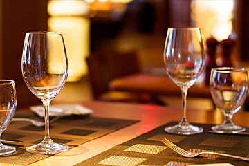 Empty wine glasses on a table in a restaurant
