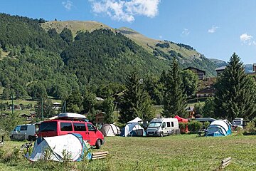 Campsite showing camper vans and tents in summer in Montriond