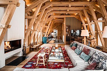 A living room with a fireplace and a couch