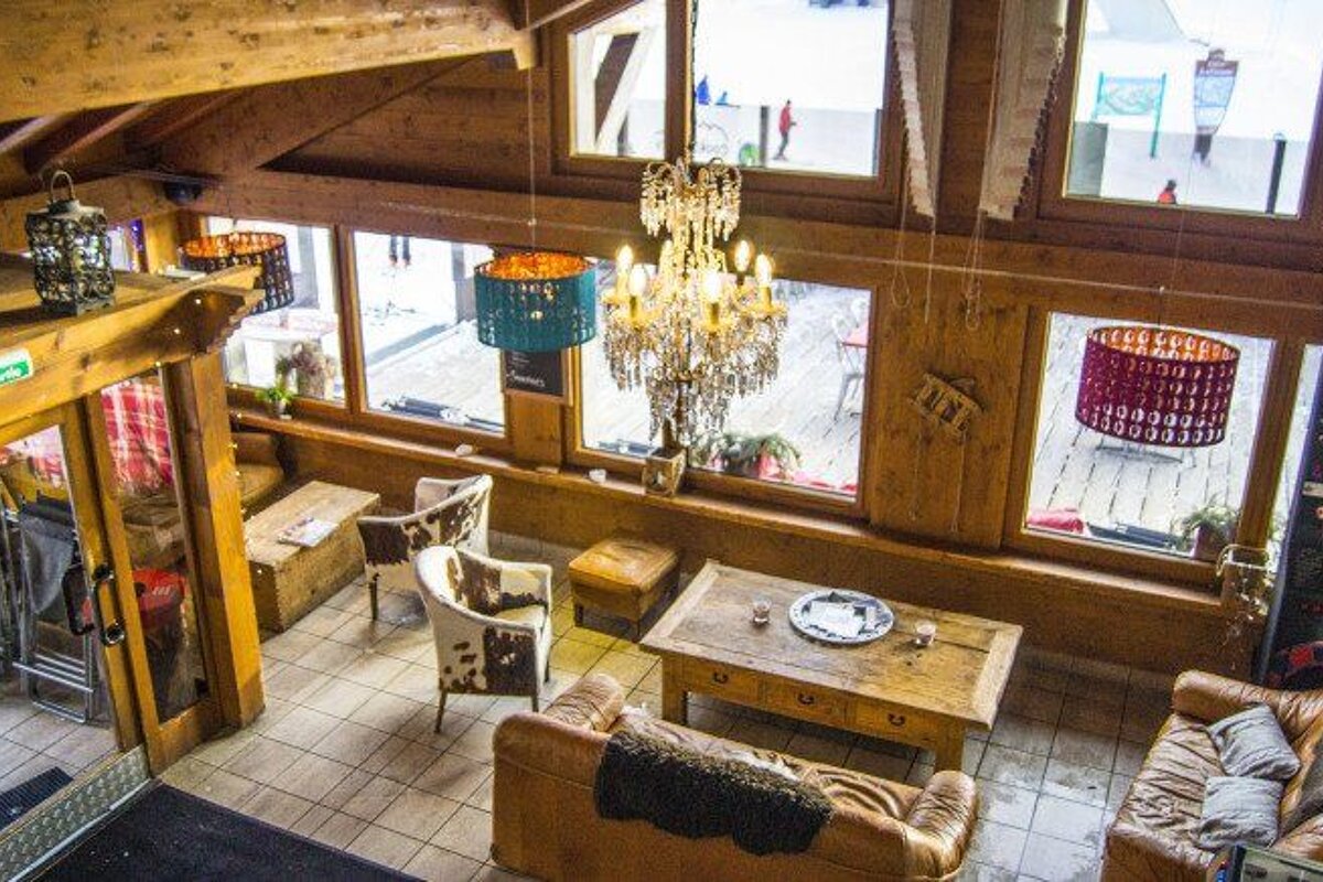 An aerial view of a living room with a dart board