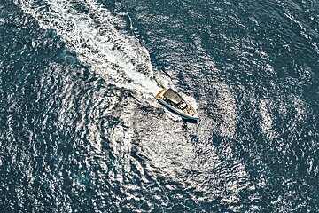 An aerial view of a boat in the ocean