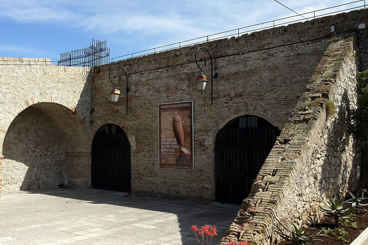 A brick wall with a sign on it that says ' a ' on it