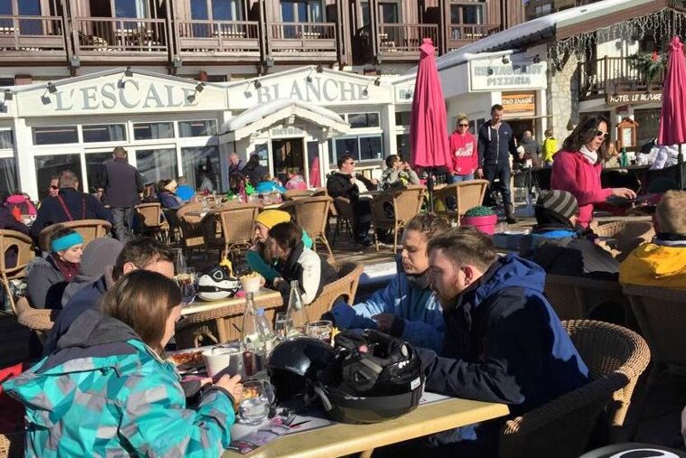 People on terrace at L'Escale Blanche, Tignes