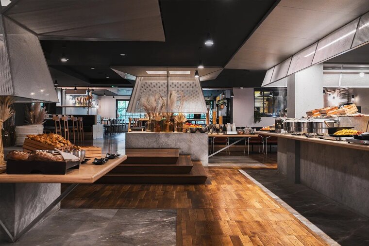 A restaurant with a lot of food on the counters