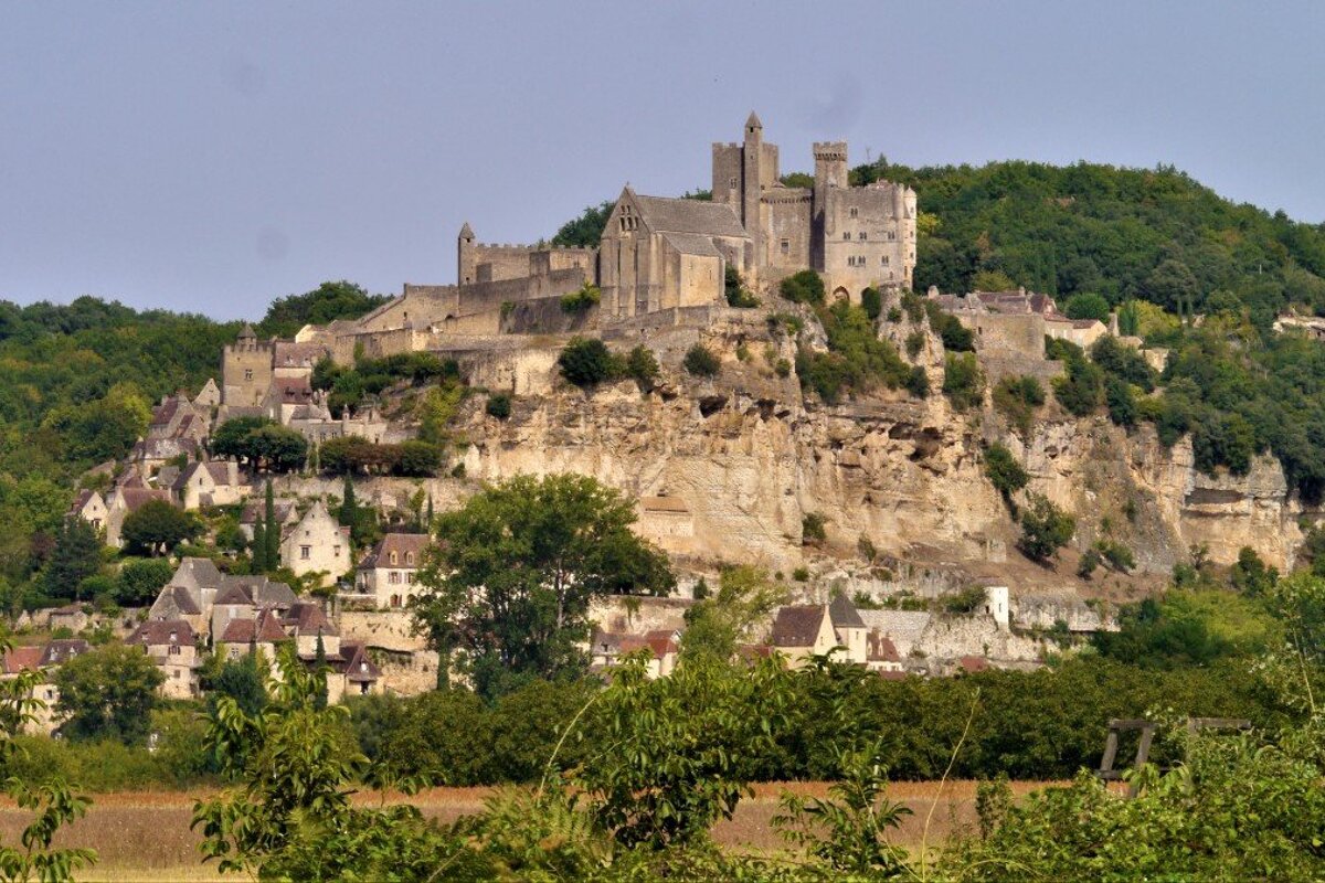 a view of chateau de beynac and the town below