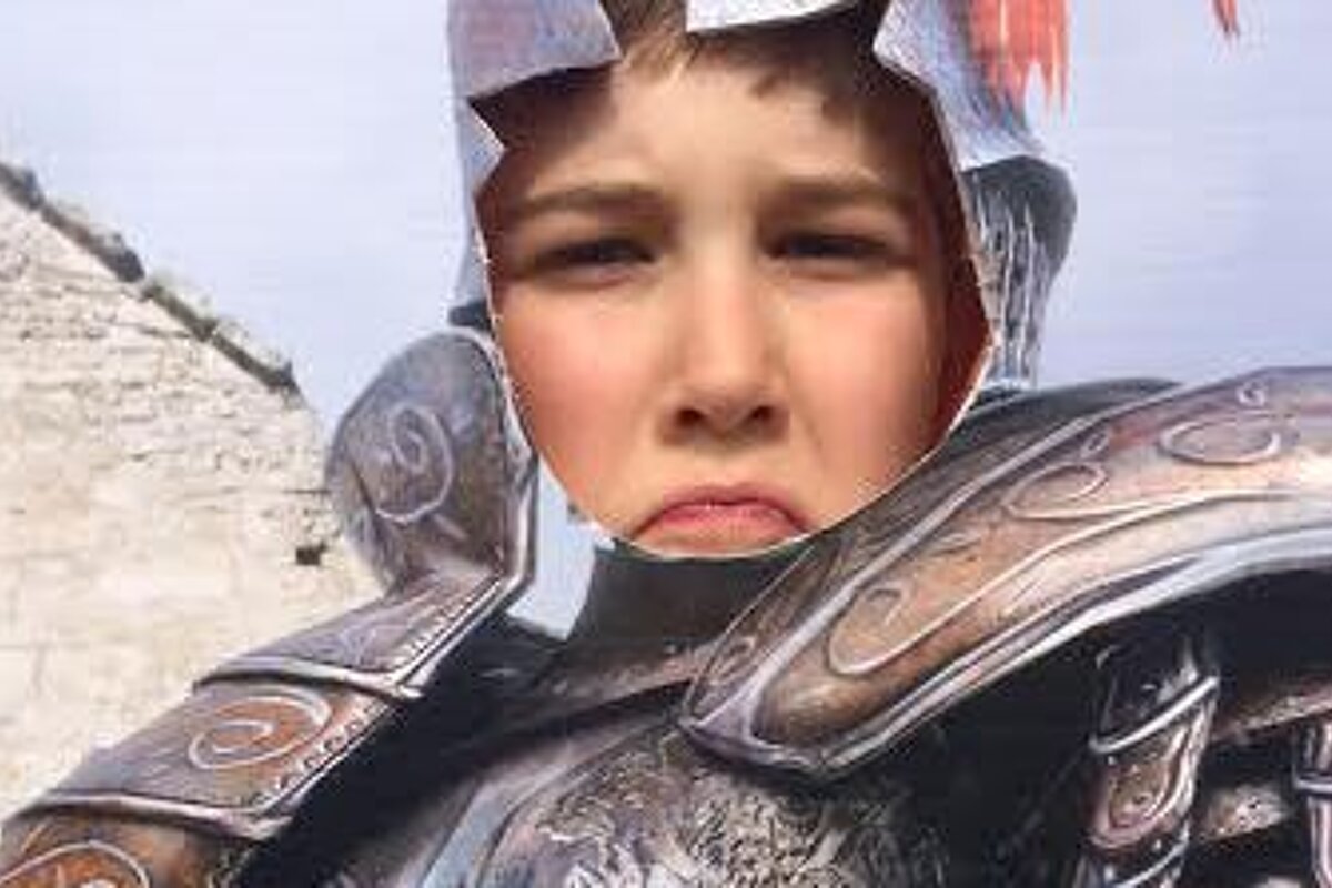 a boy in a medieval outfit