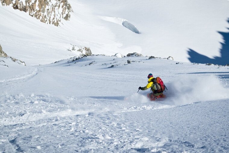 a skier in yellow off piste