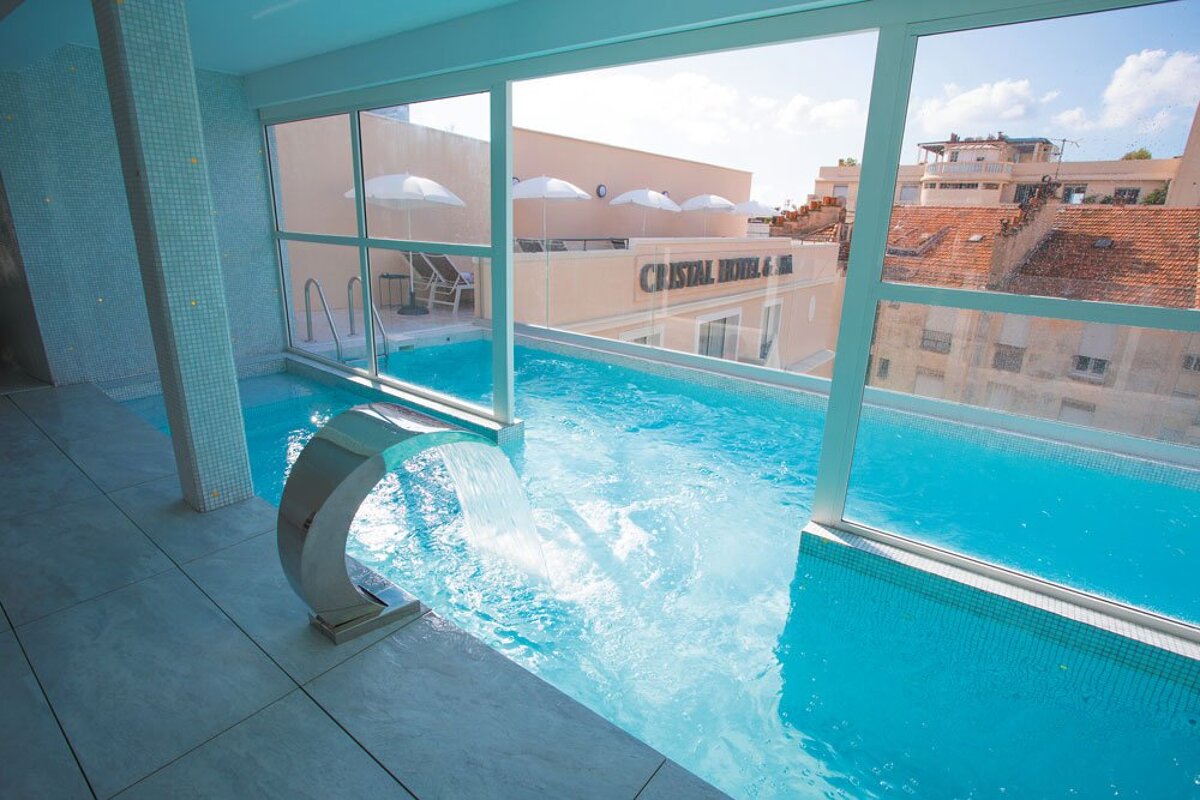 A swimming pool with the word cristal on the side of it