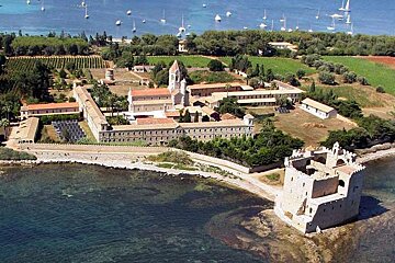 An aerial view of a castle surrounded by water