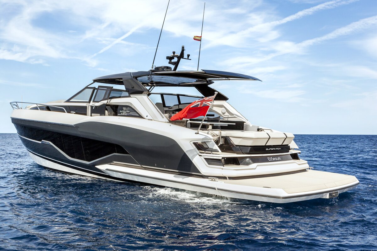 A black and white yacht with the name epsilon on the side