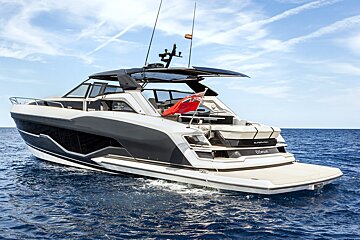 A black and white yacht with the name epsilon on the side