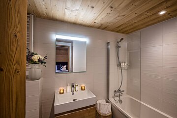A bathroom with a sink and a bathtub