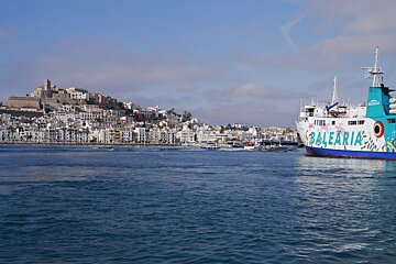 a ferry in the port of Ibiza, town in background