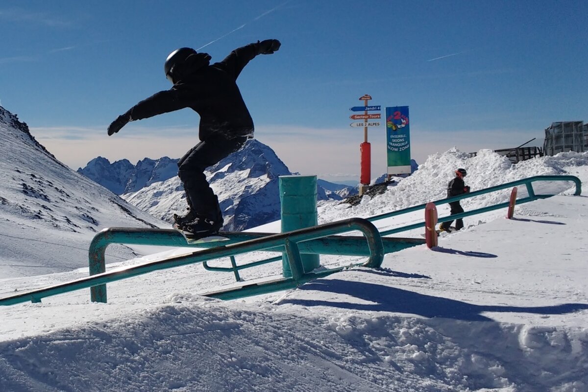 a snowboarder on a rail