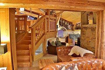 A wooden staircase leading up to the second floor of a house