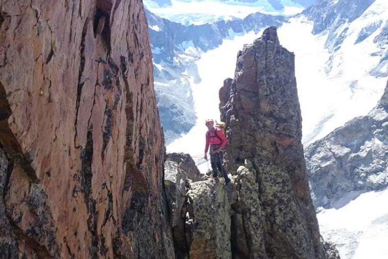 a mountaineer on a hill top