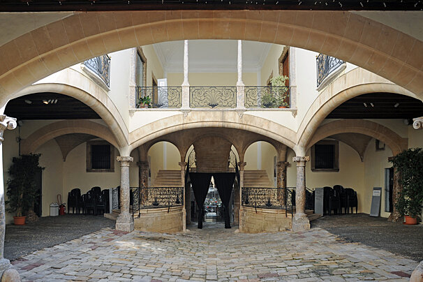 The inside of a building with arches and columns