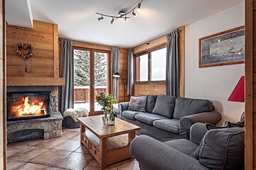 A living room with a fireplace and a couch