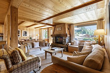A living room with a couch a chair and a fireplace