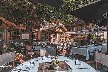 Terrace for summer barbecues and live music at Les Peupliers,  Courchevel Le Praz
