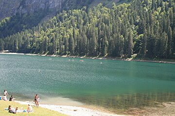 a large blue lake near morzine