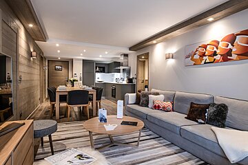 A living room with a couch and a coffee table