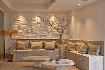 A living room with a couch and a table