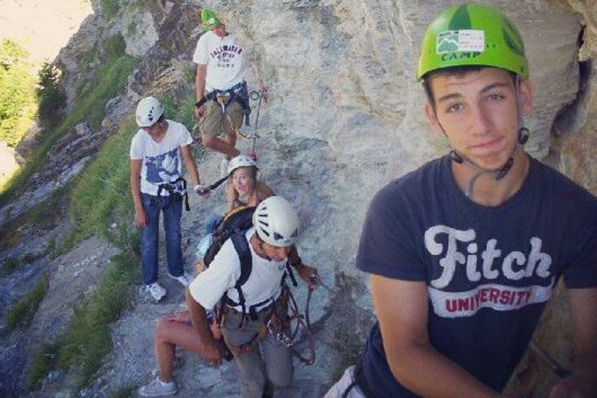 children in helmets on a via ferrata course in meribel