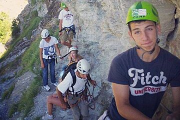 children in helmets on a via ferrata course in meribel