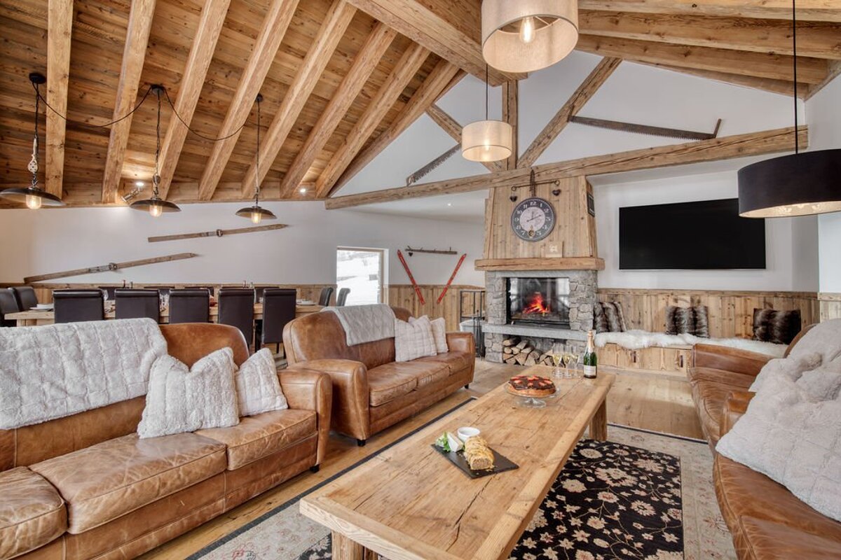 A living room with a fireplace and a clock that says ' clock ' on it