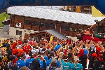 people crowd surfing at the race in courchevel