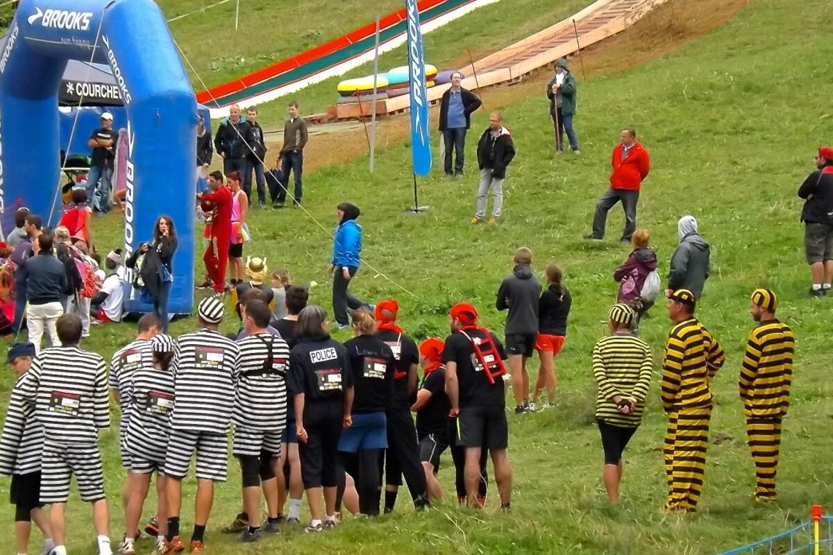 a team of people in striped costumes starting a race