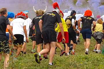 people running off up hill in fancy dress