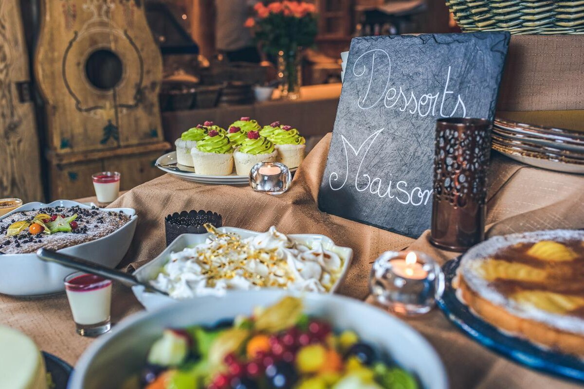 A buffet table with a sign that says desserts maison