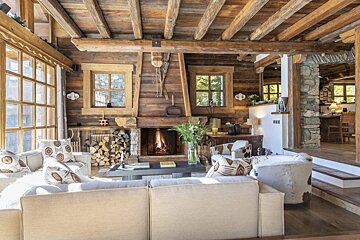 A living room with a fireplace and a couch