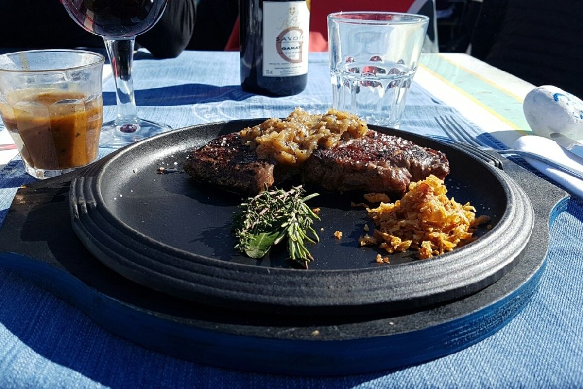 a sizzling platter of steak