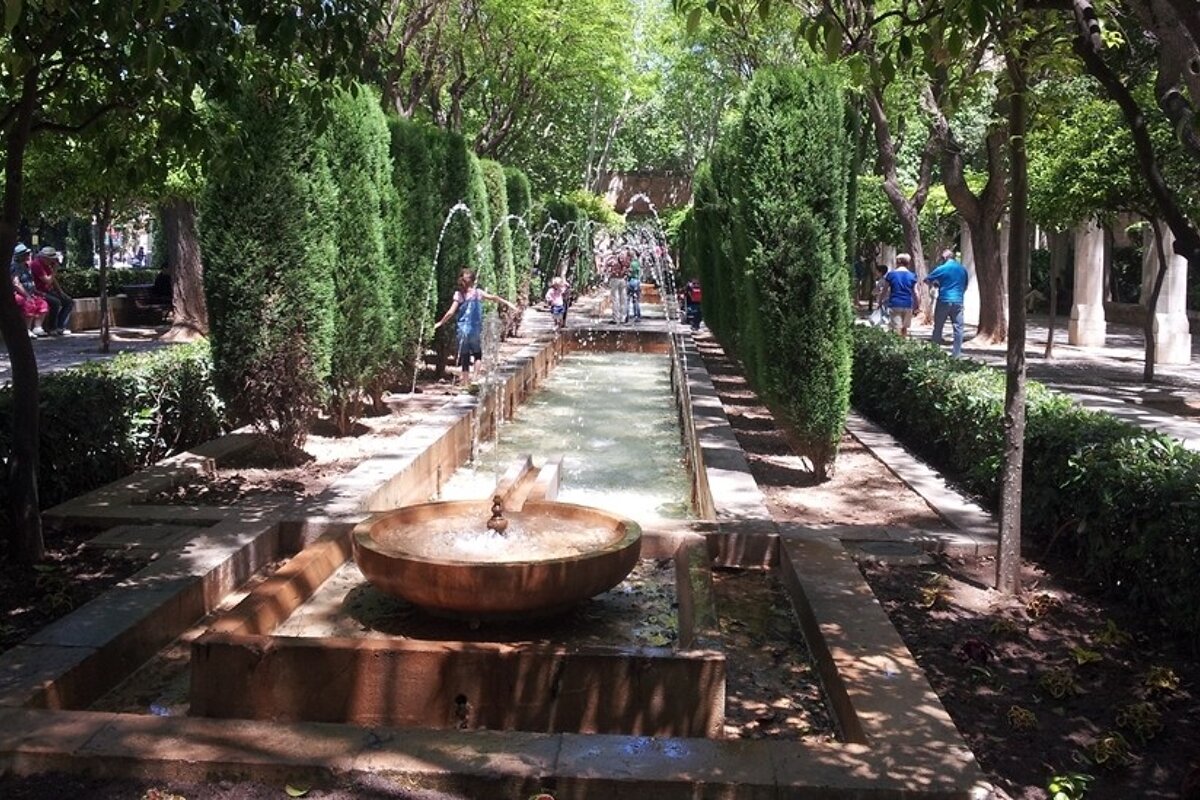 a street view with fountains outside the cathedral in palma