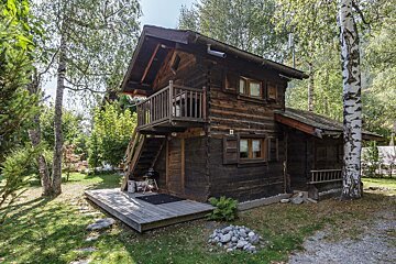 A small wooden cabin with the number 8 on the side