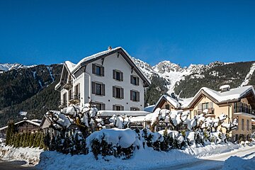 A white building with the word eden on it