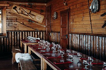A long wooden table set for a dinner party