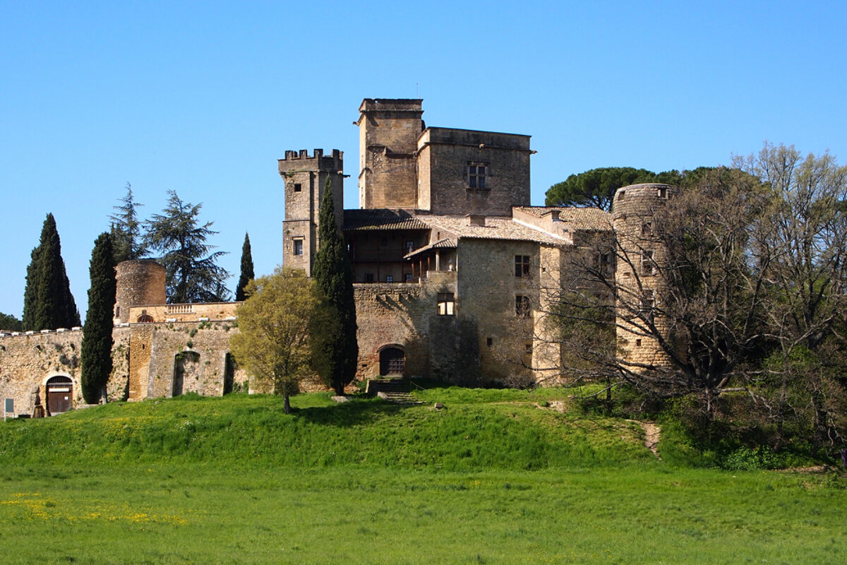 a large chateau on a hilltop