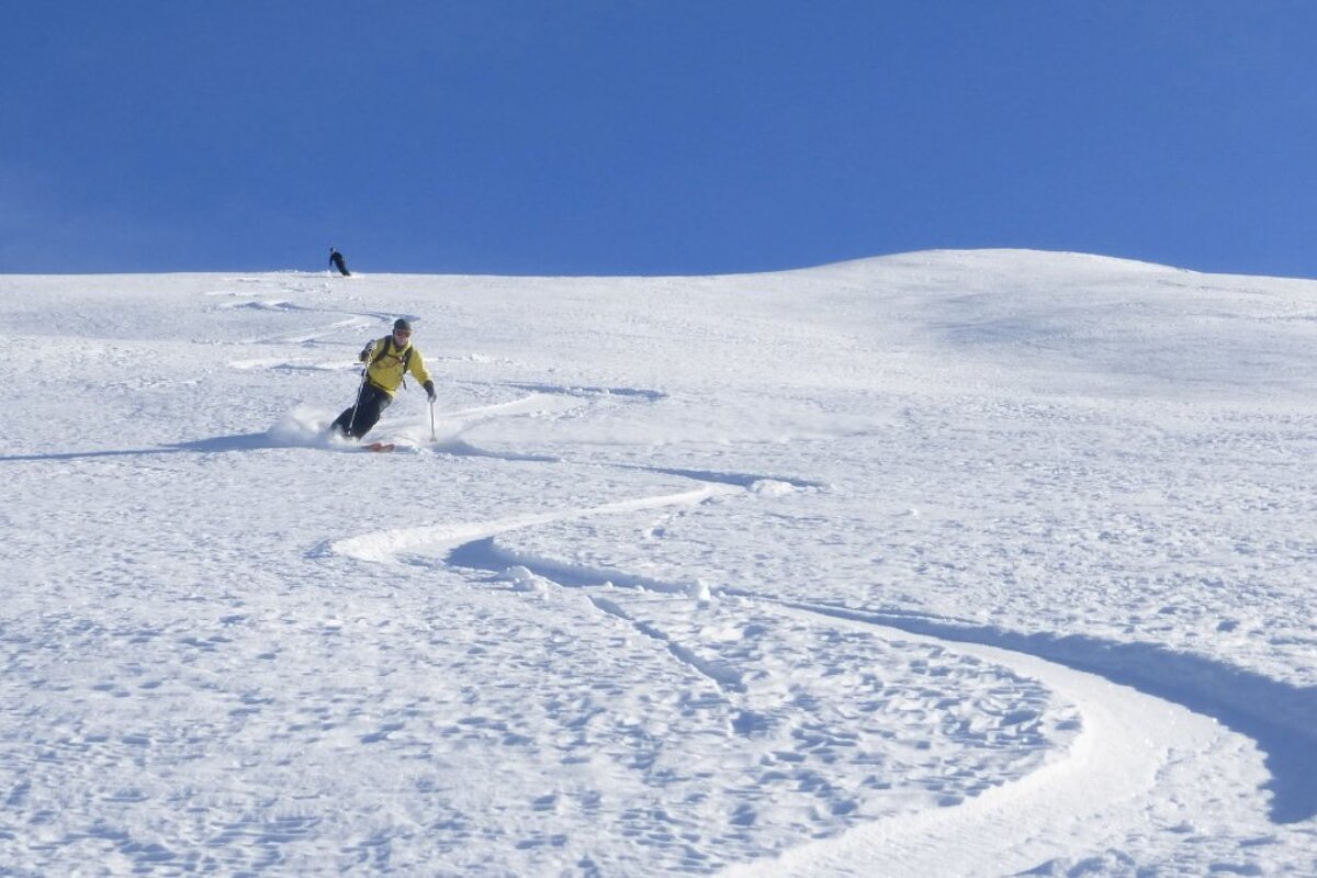 two skiers in powder
