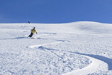 two skiers in powder