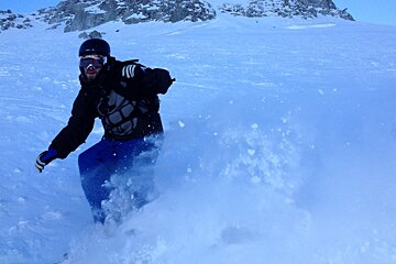 a skier in powder in chamonix