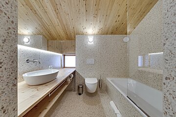 A bathroom with a sink toilet and bathtub