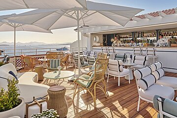 A bar with a sign that says ' bar ' on it