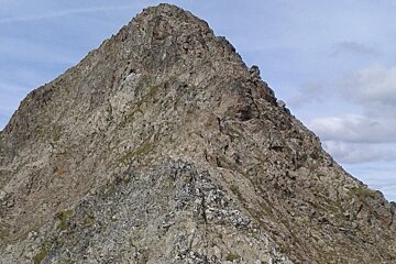 a rocky mountain in 2 Alpes
