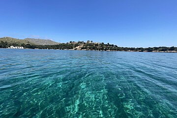 A large body of water with a small island in the background