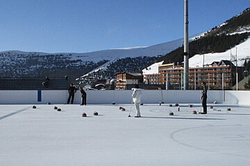 people Curling on the ice rink 