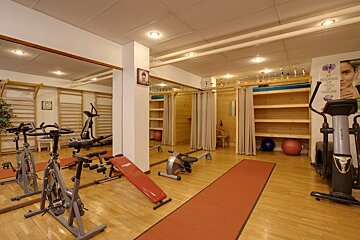 A gym with a sign on the wall that says